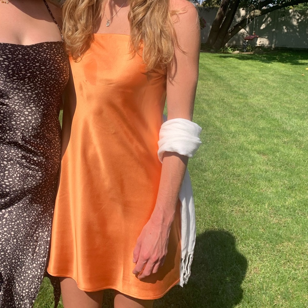 Lightly worn, silky orange sun dress. Comfortable and can be dressed up or down!